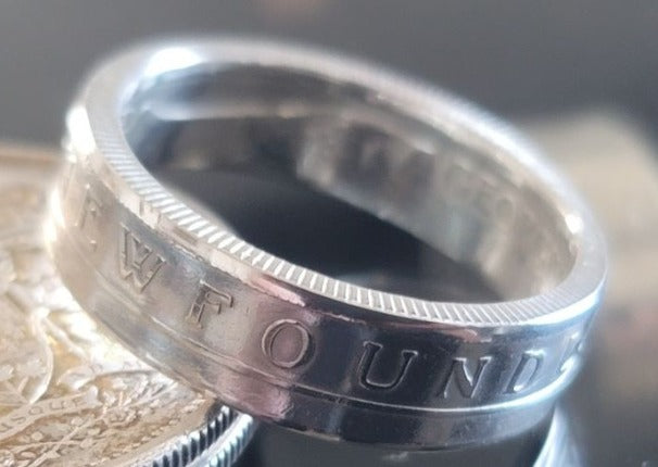 Newfoundland ring displaying the "Newfoundland" name with a bright polished finish.