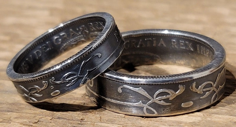 Pair of Newfoundland coin rings displaying the details of the coin.